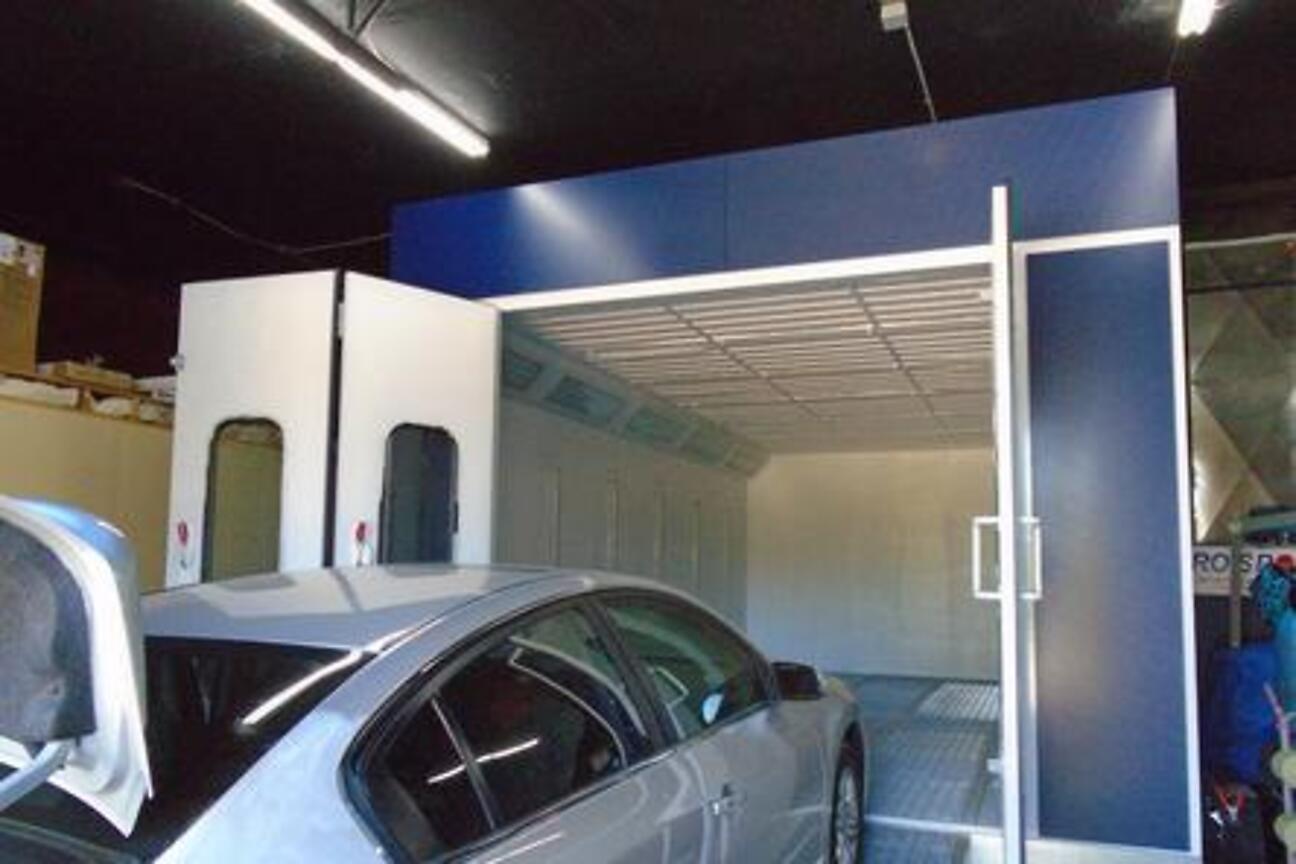 A vehicle entering the Accudraft paint booth at the shop